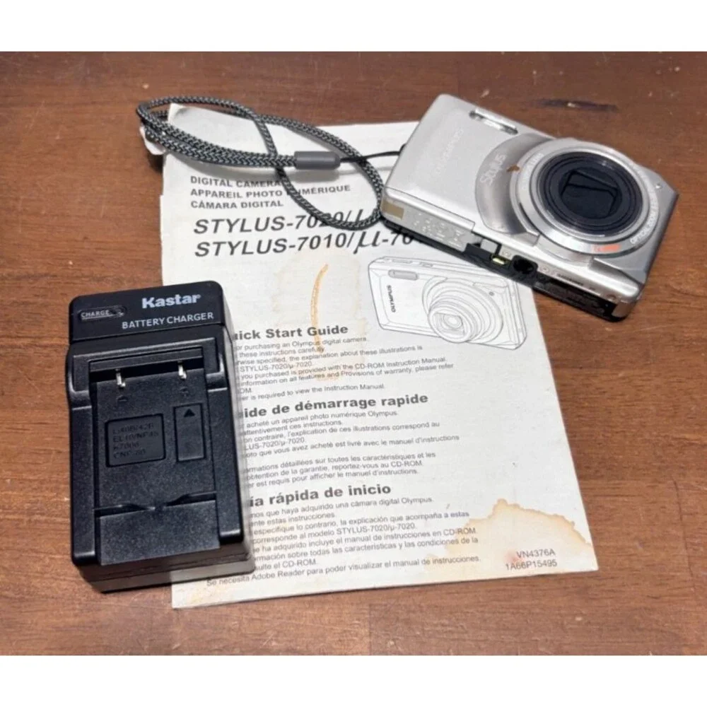 Olympus Stylus 7010 12.0MP Digital Camera Silver Point Shoot w/Batt & charger